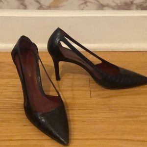Black leather pumps with red bottoms